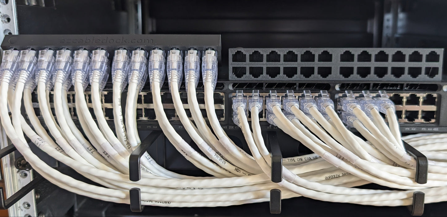 EZ Cable Dock in use during a network switch replacement—Ethernet cables securely held in place for easy transfer back to the new switch.