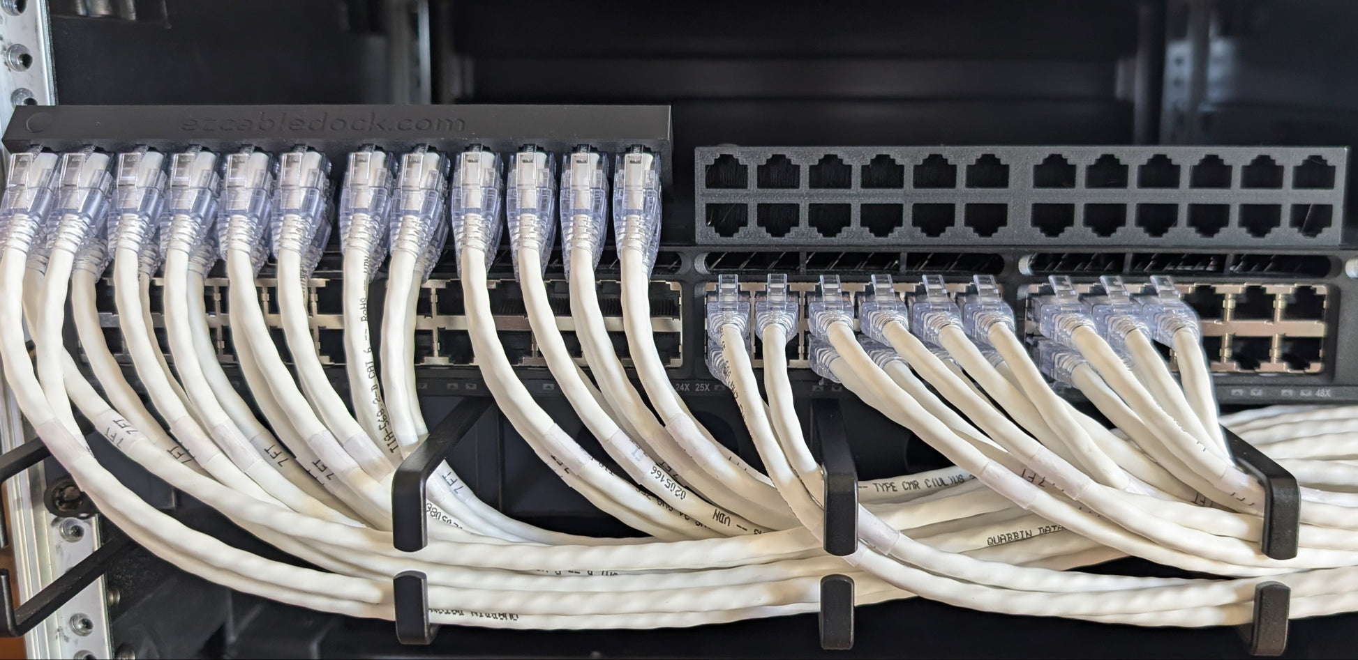 EZ Cable Dock in use during a network switch replacement—Ethernet cables securely held in place for easy transfer back to the new switch.