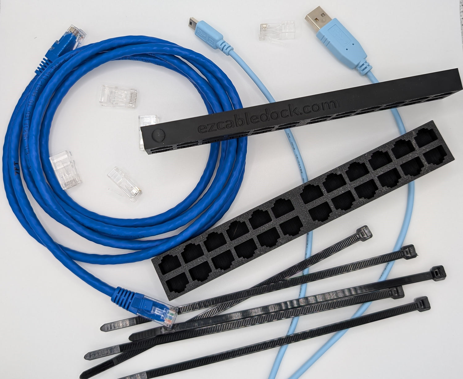 An image displaying essential tools for network switch replacement, including console cable, network cable, zip ties, and the EZ Cable Dock holding organized Ethernet cables. The setup highlights the EZ Cable Dock’s role in simplifying cable management during the replacement process.