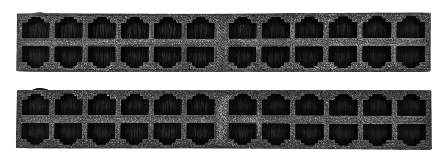 EZ Cable Dock – A compact, rectangular block with multiple RJ45 ports on the front, designed to temporarily hold and organize Ethernet cables. It resembles a network switch or patch panel but contains no electronic components. The ports are arranged in two blocks, separated by a small gap, with a raised circular indicator on the first port for easy identification.